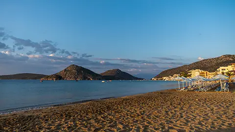 View from Tolo beach looking toward the village with Romvi and Koronisi Islands in the back