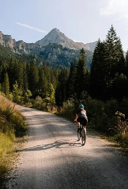 Person Cycling on Dirt roads through the Countryside