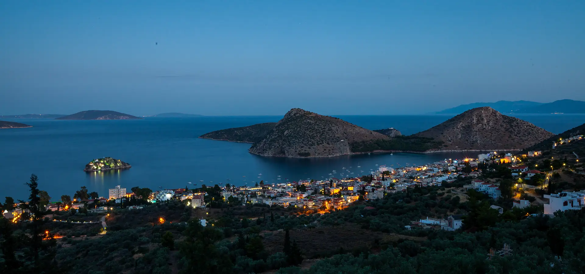 View of Tolo village with lights at dusk